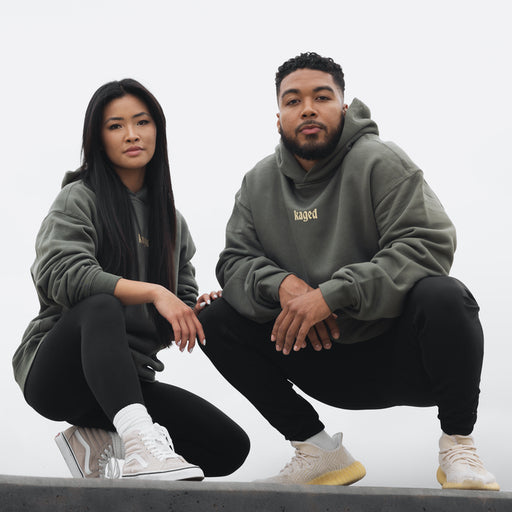 Male and Female Kaged Athletes Posing in Kaged Apparel